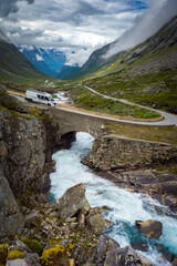 Glacier melt river flowing alongside road in the valley of Fjord in Norway during summer