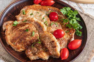 Pork chops. Hot meat dish. Healthy food, delicious homemade food. Close-up. On ceramic plate