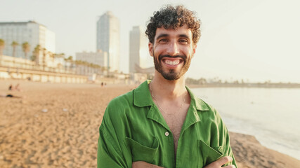 Close-up of young guy looking at the camera with smile