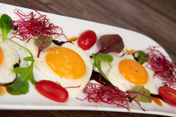 RECIPE FOR FRIED EGGS AND POMEGRANATE MOLASSES CUT INTO HEARTS, STARS AND FLOWERS. High quality photo