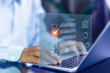 Survey Online concept. Businessman uses laptop and manages online survey. productivity checklist and filling survey form online, answer questions of test. Education futuristic technology and learning.