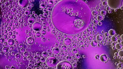 Abstract Colorful Food Oil Drops Bubbles and spheres Flowing on Water Surface - 687485225