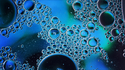 Abstract Colorful Food Oil Drops Bubbles and spheres Flowing on Water Surface - 687485232