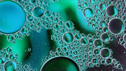 Abstract Colorful Food Oil Drops Bubbles and spheres Flowing on Water Surface - 687485241