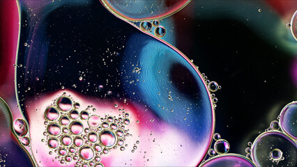 Abstract Colorful Food Oil Drops Bubbles and spheres Flowing on Water Surface - 687485403