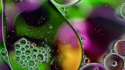 Abstract Colorful Food Oil Drops Bubbles and spheres Flowing on Water Surface - 687485407