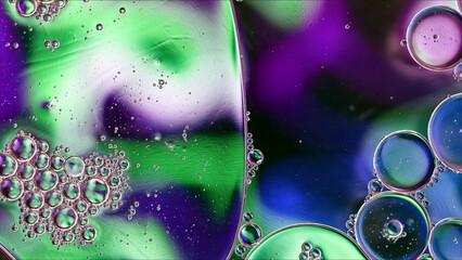 Abstract Colorful Food Oil Drops Bubbles and spheres Flowing on Water Surface - 687485408