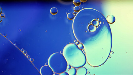 Abstract Colorful Food Oil Drops Bubbles and spheres Flowing on Water Surface - 687485425