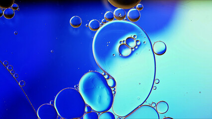 Abstract Colorful Food Oil Drops Bubbles and spheres Flowing on Water Surface - 687485476