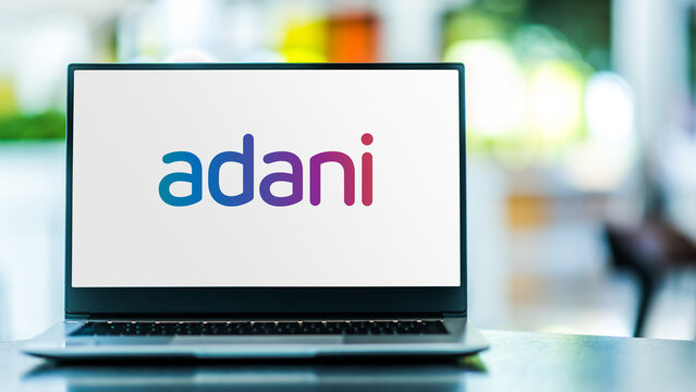Laptop computer displaying logo of Adani Group