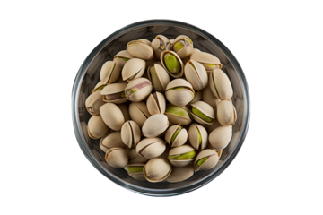 vu de dessus d'un bol rempli de pistaches salées