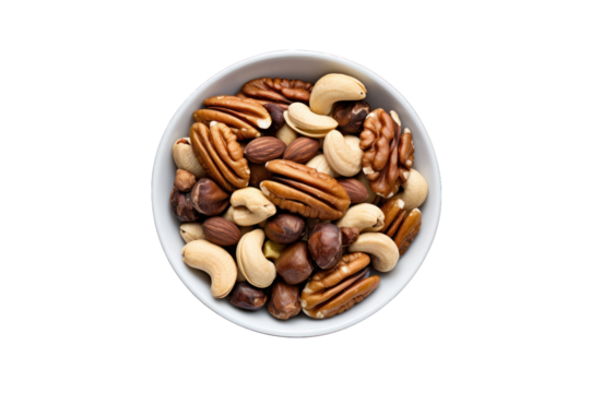 vu de dessus d'un bol rempli d'un assortiment de noix, noix de pécan, cacahouète, noisette, raisins secs et pistache