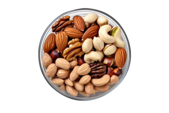 vu de dessus d'un bol rempli d'un assortiment de noix, noix de pécan, cacahouète, noisette, raisins secs et pistache