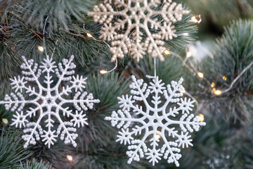 Artificial snowflakes decoration on the Christmas tree