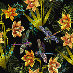 Embroidery yellow narcissuses flowers and dragonflies, floral seamless pattern. Spring daffodils on black background. Botanical vector illustration. Template for clothes, textiles, t-shirt design