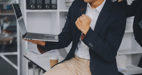 Business professionals. Group of young confident business people analyzing data using computer while spending time in the office