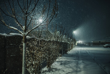 Night street in cold winter snowstorm