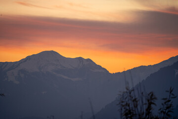 Sunrise sunset dusk dawn colors over the himalaya mountains with fog haze in distance with rich...