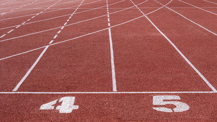 running track with lane numbers on the outdoor athletic stadium. 