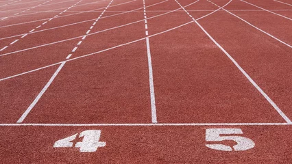 Fotobehang running track with lane numbers on the outdoor athletic stadium.  © zhikun sun