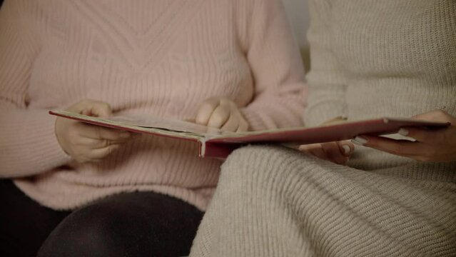 Woman looking life memories old photo album. Nostalgic memory at elderly time	