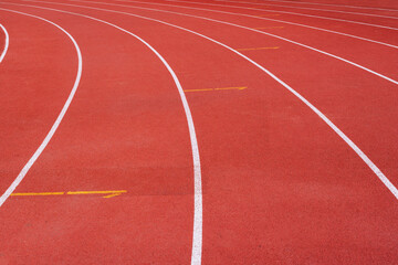 Fototapeta premium running track with lane numbers on the outdoor athletic stadium. 