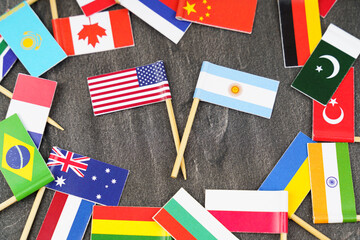 Fototapeta na wymiar The concept is diplomacy. In the middle among the various flags are two flags - USA, Argentina