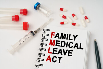 On the table are pills, injections, a syringe and a notepad with the inscription - family medical...