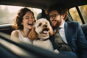  The newly married bride and groom went on a wedding trip by car with a dog © Alina