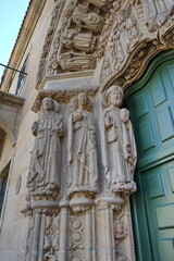 Statues on the facade of the 'Colexio de San Xerome' in Compostela. Saint Francis of Assisi, Saint John the Evangelist and the Apostle Saint James 
Santiago de Compostela, Galicia, Spain 10092023