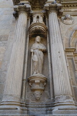 Statue on the facade of the 'Colexio de Fonseca' on 'R&uacute;a do Franco' street in Santiago de Compostela Santiago de Compostela, Galicia, Spain 10092023