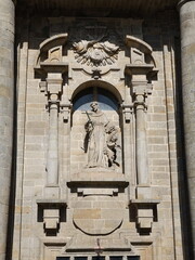 Central part of the facade of the church of San Francisco, which features four Doric columns flanking an image of San Francisco Santiago de Compostela, Galicia, Spain 10092023