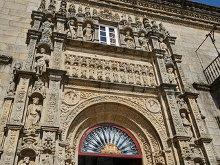 Facade of the hotel 'Hostal dos Reis Cat&oacute;licos' in the 'Praza do Obradoiro' in the city of Santiago de Compostela Santiago de Compostela, Galicia, Spain 10092023