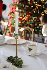 candle on the festive table for Christmas