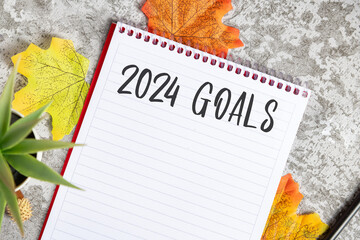 Notebook with 2024 goals written on it to make new plans in the new year