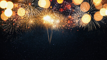 Beautiful golden fireworks on the starry sky with a yellow bokeh light.  New Year 2024 and...