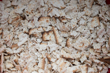 Pieces of crushed Matzah, an unleavened flatbread that is part of Jewish cuisine and forms an integral element of the Passover festival