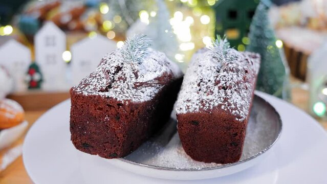 Christmas bread on the Christmas table. Chives sprinkled with sweet white powder are found on the table.