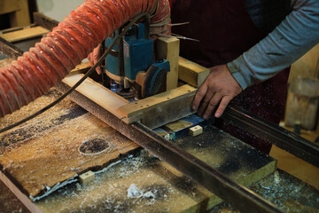 Focused woodworking on a machine. This scene captures the balance between technology and craftsmanship.