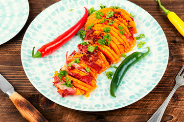 Baked pumpkin or squash with bacon.