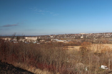 A landscape with trees and buildings