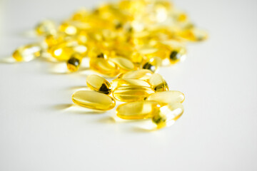 Capsules of Omega 3 on white background. Health care concept. Medical pill or vitamin's capsule pattern. Medicine, healthcare or pharmacy concept.