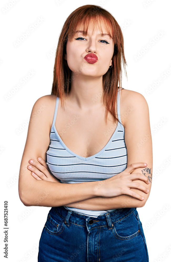 Canvas Prints redhead young woman with arms crossed gesture looking at the camera blowing a kiss being lovely and 