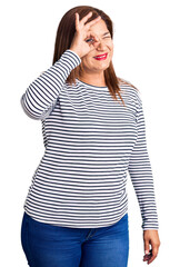 Fototapeta premium Middle age latin woman wearing casual clothes smiling happy doing ok sign with hand on eye looking through fingers