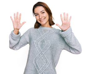 Young caucasian girl wearing casual clothes showing and pointing up with fingers number ten while smiling confident and happy.