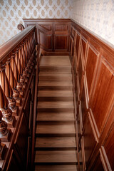Interior of the house. Classic wooden staircase.