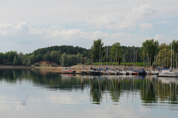 Fototapeta na wymiar Bank of a little lake in Bavaria with some boats