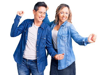 Couple of women wearing casual clothes dancing happy and cheerful, smiling moving casual and confident listening to music
