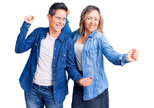 Couple of women wearing casual clothes dancing happy and cheerful, smiling moving casual and confident listening to music