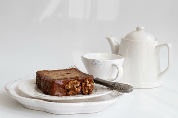 a slice of Chocolate cake topped with walnuts